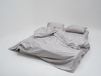 Picarde Form duvet cover set in grey with matching pillowcase, loosely dressed