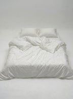 Bloom set seen straight on, duvet and two Oxford pillowcases in the same woven floral