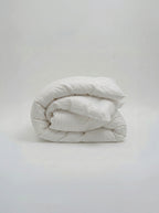 Picarde Form duvet cover folded in white, showing the weight and finish of the cotton
